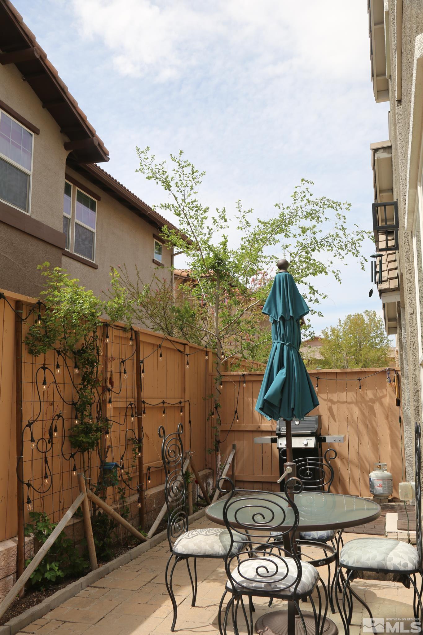 1872 Wind Ranch Road, Unit A Reno, NV 89521 - Photo 30 of 33 a view of a chairs and table on the terrace