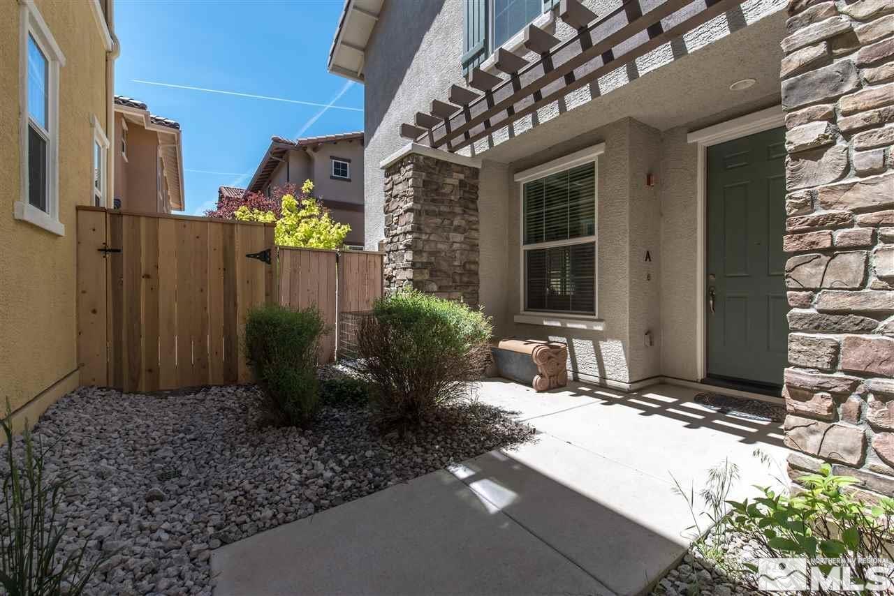 1872 Wind Ranch Road, Unit A Reno, NV 89521 - Photo 3 of 33 a view of a house with a backyard