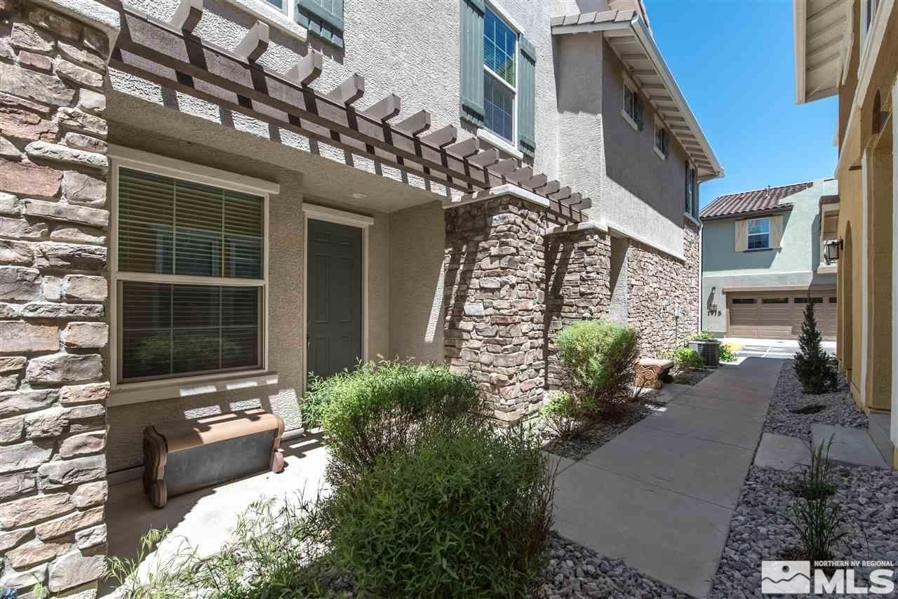 1872 Wind Ranch Road, Unit A Reno, NV 89521 - Photo 4 of 33 a front view of a house with a yard