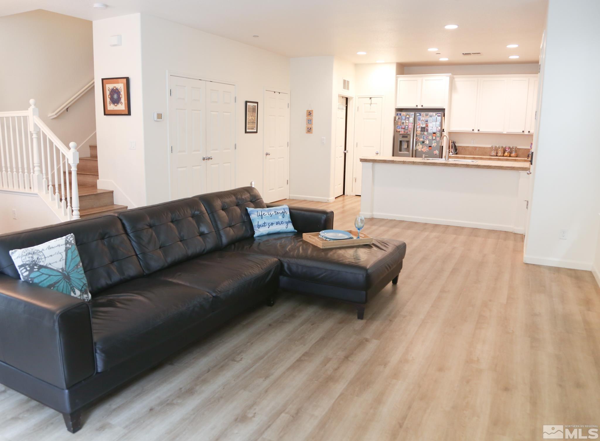 1872 Wind Ranch Road, Unit A Reno, NV 89521 - Photo 8 of 33 a living room with furniture and kitchen view