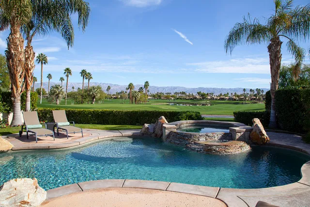 a view of a table and chairs in the garden