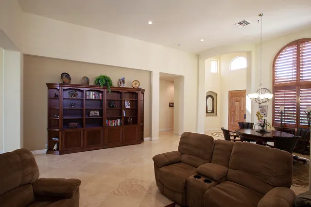 a living room with furniture and closet