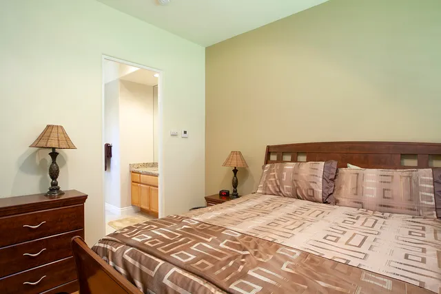 a bedroom with a bed and a dresser