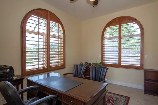 a view of a livingroom with furniture and a window