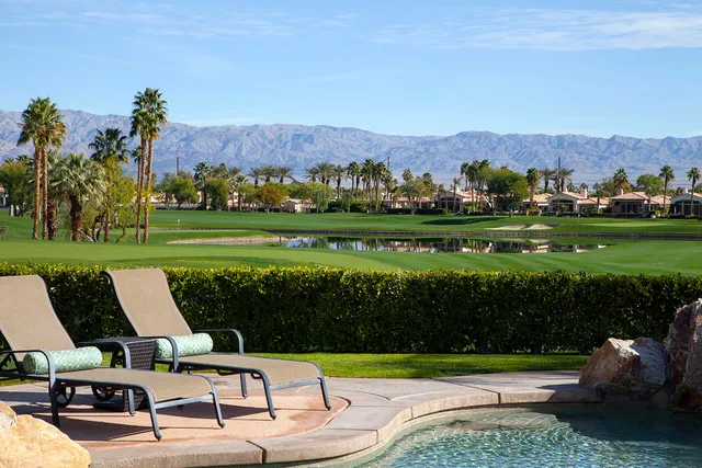 a view of a table and chairs in the garden