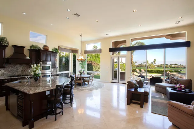 a very nice looking living room with furniture and a large window