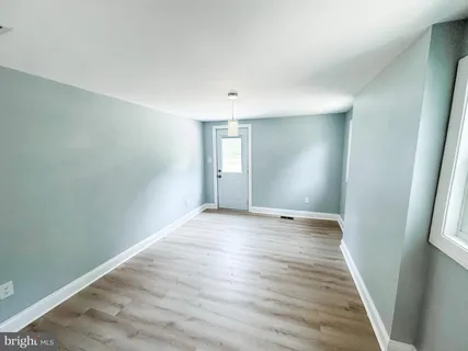 a view of a livingroom with wooden floor