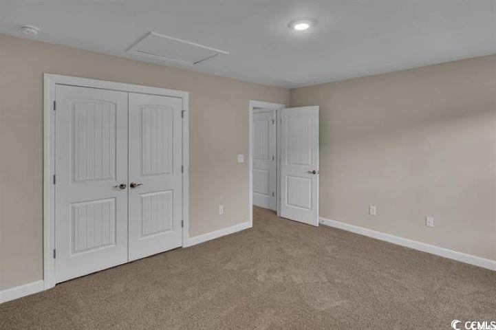 296 Starlit Way Myrtle Beach, SC 29579 - Photo 23 of 28 Unfurnished bedroom featuring light colored carpet