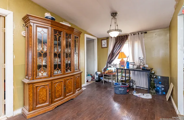 a room with gym equipment and windows