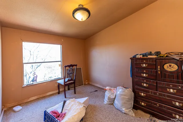 a kitchen with a stove and a refrigerator