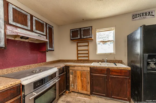 an empty room with a empty space and windows