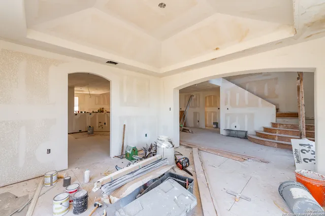 an aerial view of residential houses with outdoor space and mountain view