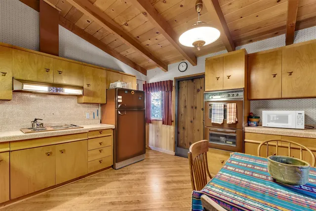a kitchen with stainless steel appliances granite countertop a sink and cabinets