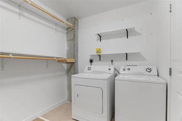 a utility room with dryer and washer