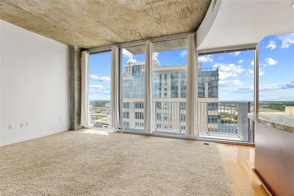 a view of an empty room with windows