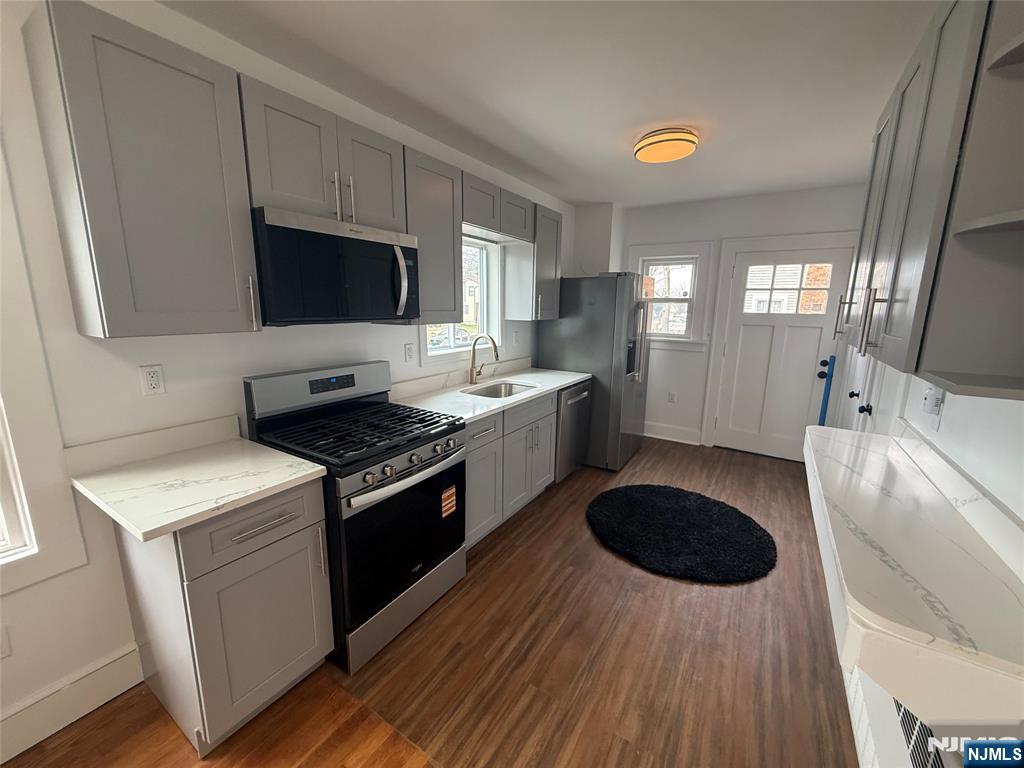 131 West Ramapo Avenue Mahwah, NJ 07430 - Photo 1 of 27 a kitchen with a sink a stove and a microwave