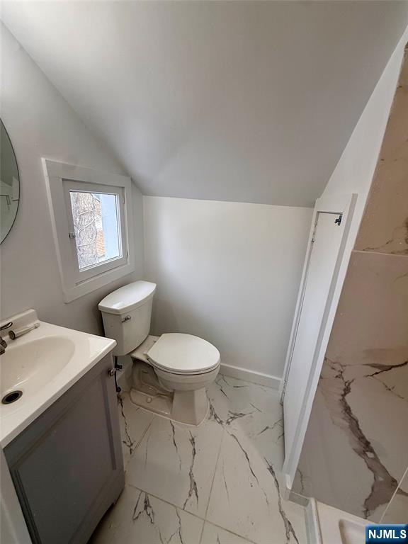 131 West Ramapo Avenue Mahwah, NJ 07430 - Photo 19 of 27 a white toilet sitting next to a bathroom sink