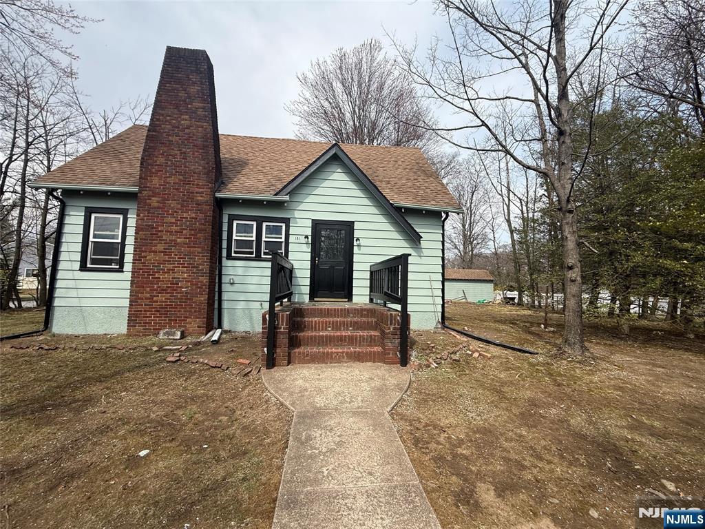 131 West Ramapo Avenue Mahwah, NJ 07430 - Photo 21 of 27 a view of a house with a yard and large tree