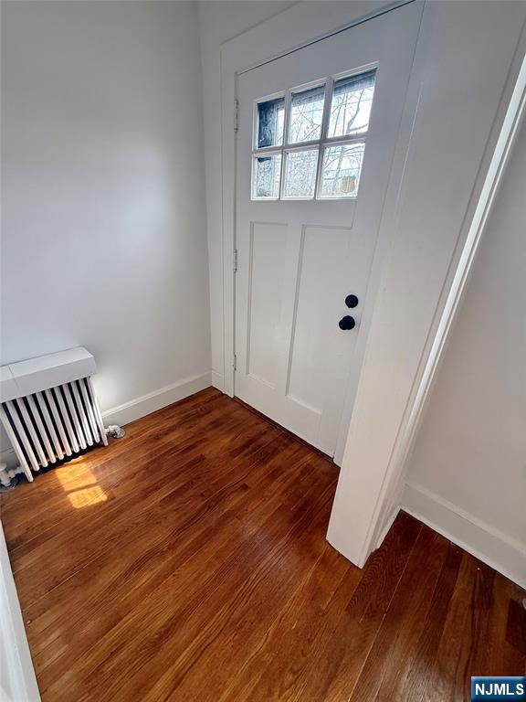 131 West Ramapo Avenue Mahwah, NJ 07430 - Photo 23 of 27 an empty room with wooden floor and windows