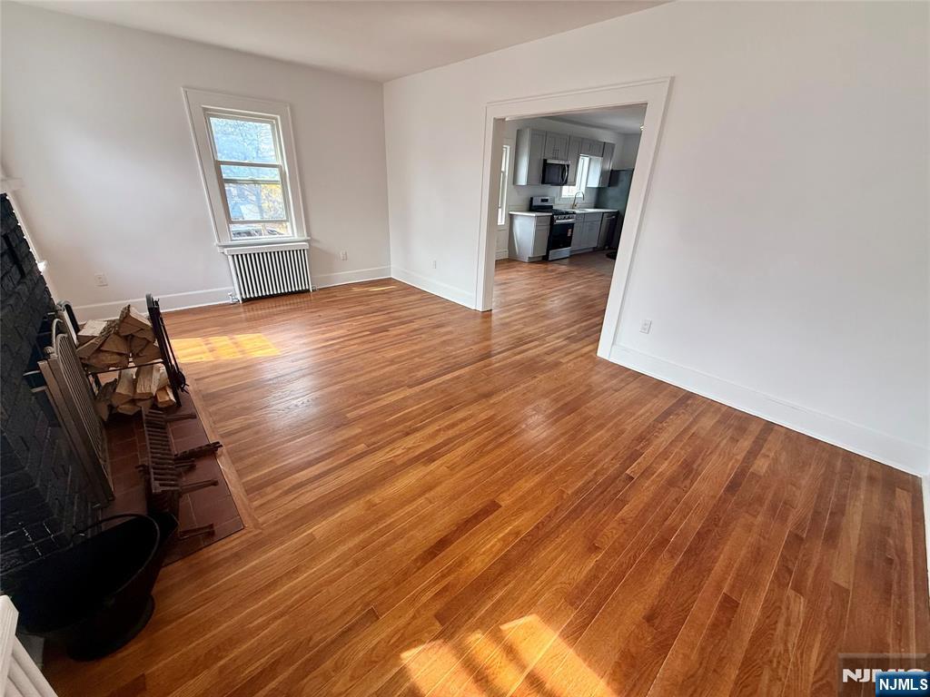131 West Ramapo Avenue Mahwah, NJ 07430 - Photo 7 of 27 a view of empty room with wooden floor