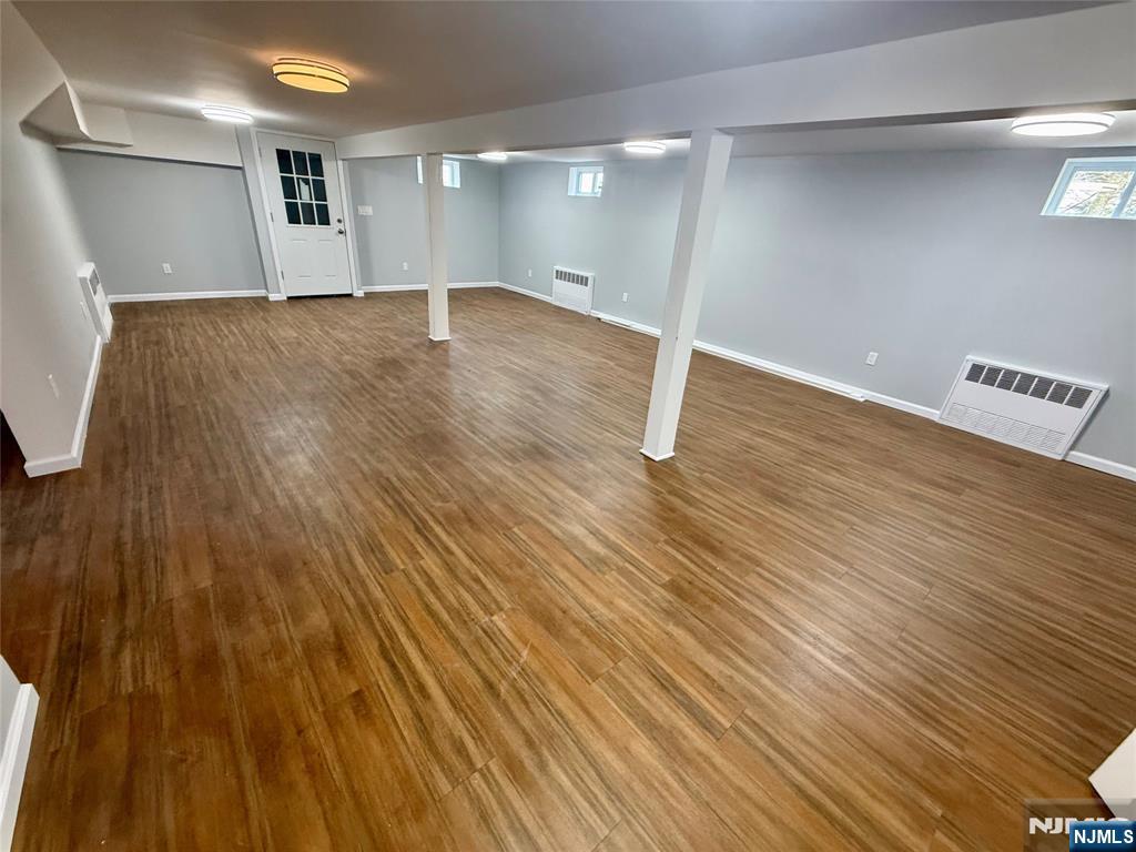 131 West Ramapo Avenue Mahwah, NJ 07430 - Photo 9 of 27 an empty room with wooden floor and windows