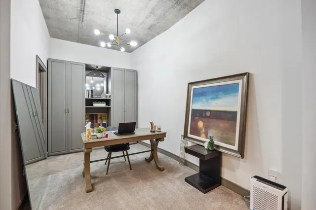 a workspace with furniture and window