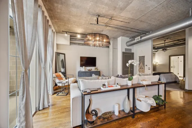 a room with lots of furniture and view of living room