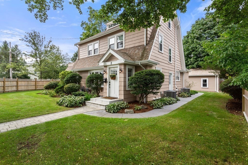 a front view of a house with a yard and porch