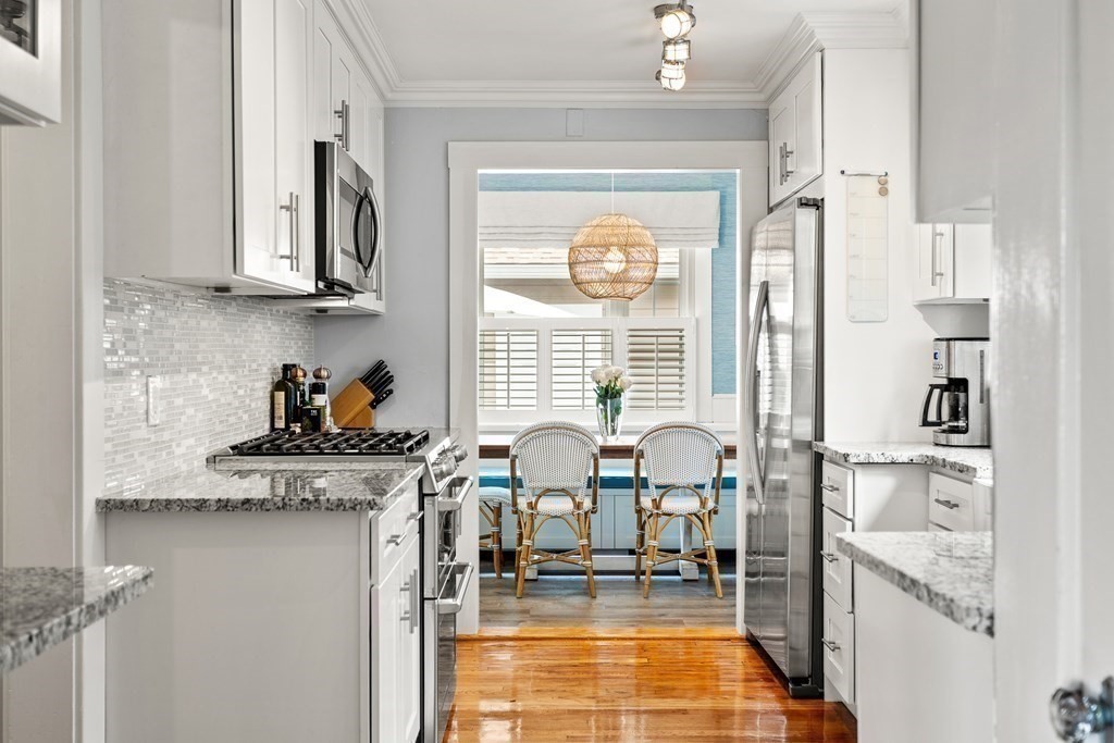 2 Charlotte Road Marblehead, MA 01945 - Photo 11 of 29 a kitchen with stainless steel appliances granite countertop a stove and a refrigerator