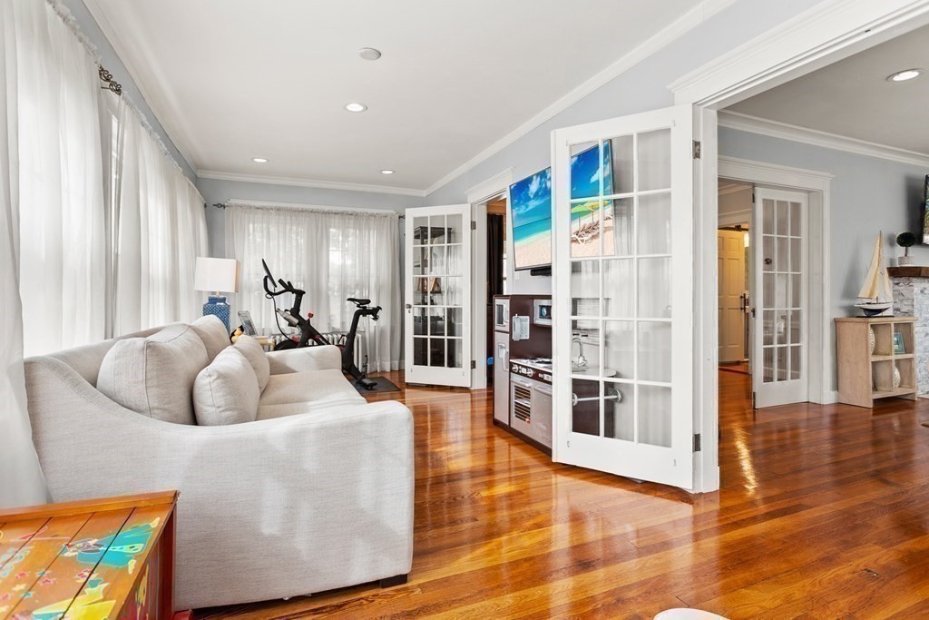 2 Charlotte Road Marblehead, MA 01945 - Photo 13 of 29 a living room with furniture and a book shelf