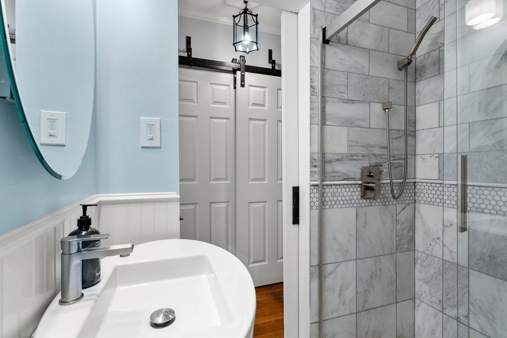 2 Charlotte Road Marblehead, MA 01945 - Photo 19 of 29 a bathroom with a sink and a mirror