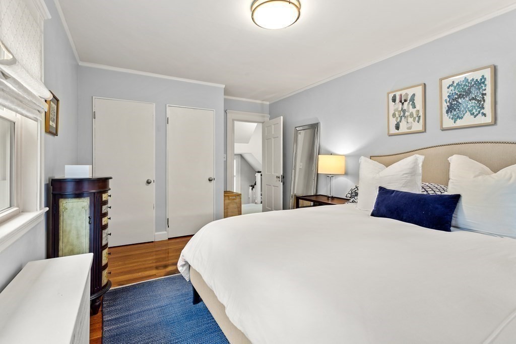 2 Charlotte Road Marblehead, MA 01945 - Photo 20 of 29 a bedroom with a bed and a wooden floor