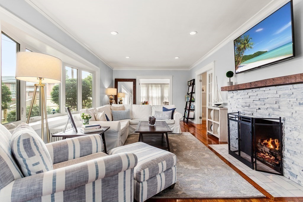 2 Charlotte Road Marblehead, MA 01945 - Photo 4 of 29 a living room with furniture large window and a fireplace