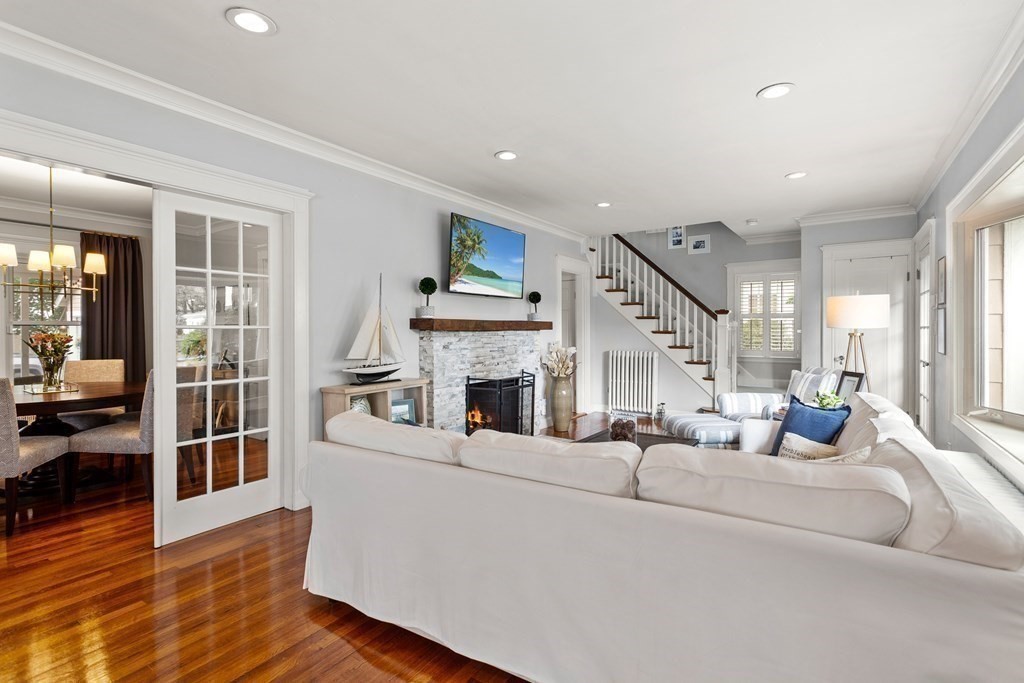 2 Charlotte Road Marblehead, MA 01945 - Photo 6 of 29 a living room with fireplace furniture and a wooden floor