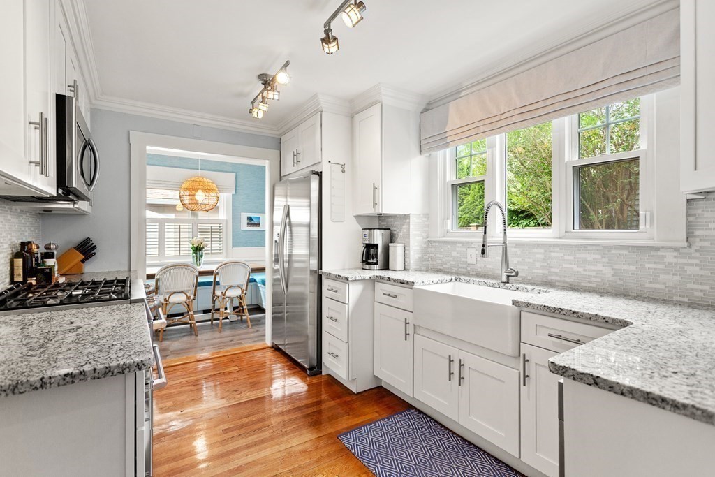 2 Charlotte Road Marblehead, MA 01945 - Photo 9 of 29 a kitchen with stainless steel appliances granite countertop a stove a sink and a refrigerator