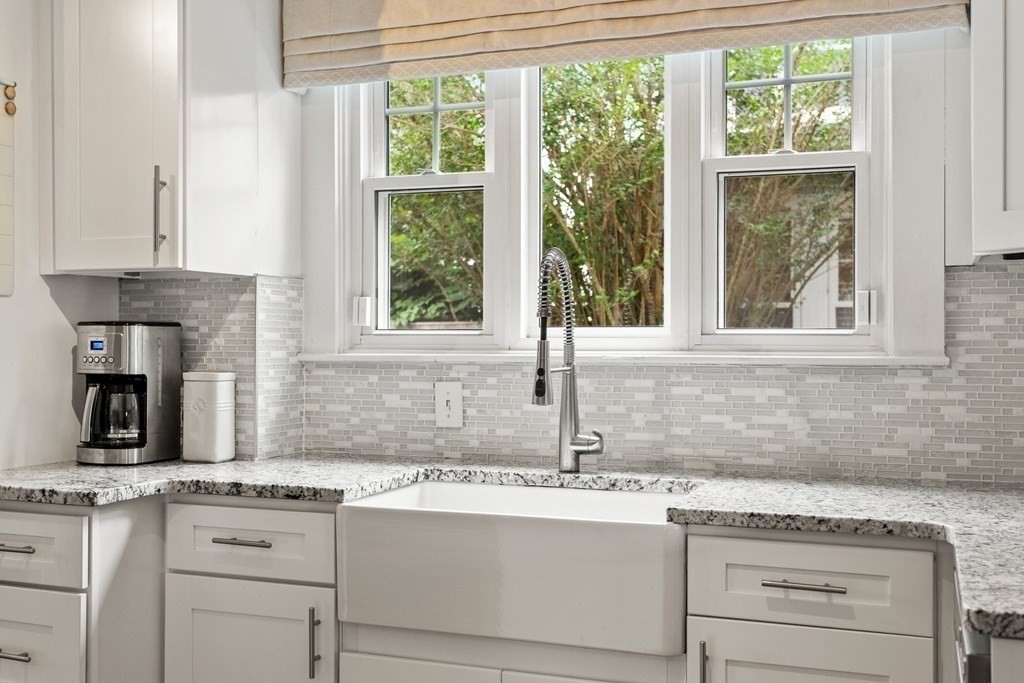 2 Charlotte Road Marblehead, MA 01945 - Photo 10 of 29 a kitchen with granite countertop a sink window and cabinets