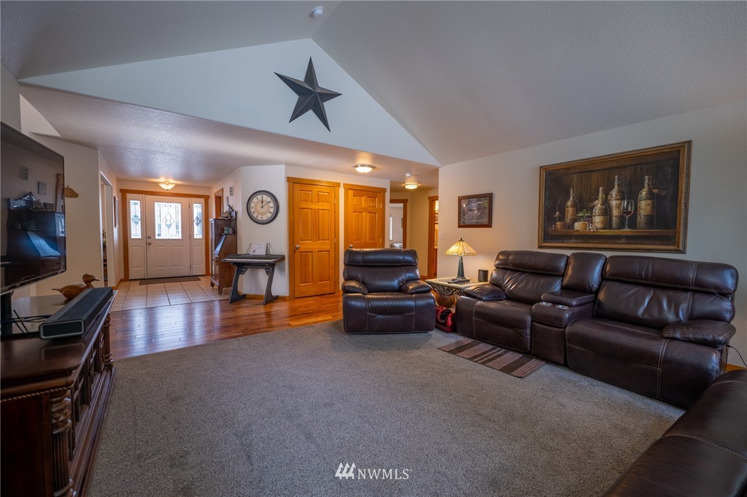 7514 191st Avenue Southwest Rochester, WA 98579 - Photo 11 of 39 a living room with furniture and a flat screen tv