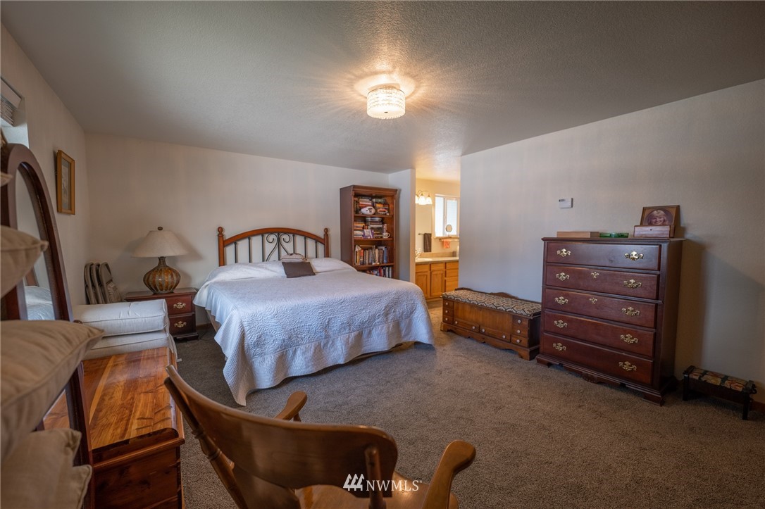 7514 191st Avenue Southwest Rochester, WA 98579 - Photo 17 of 39 a bedroom with a bed and with furniture