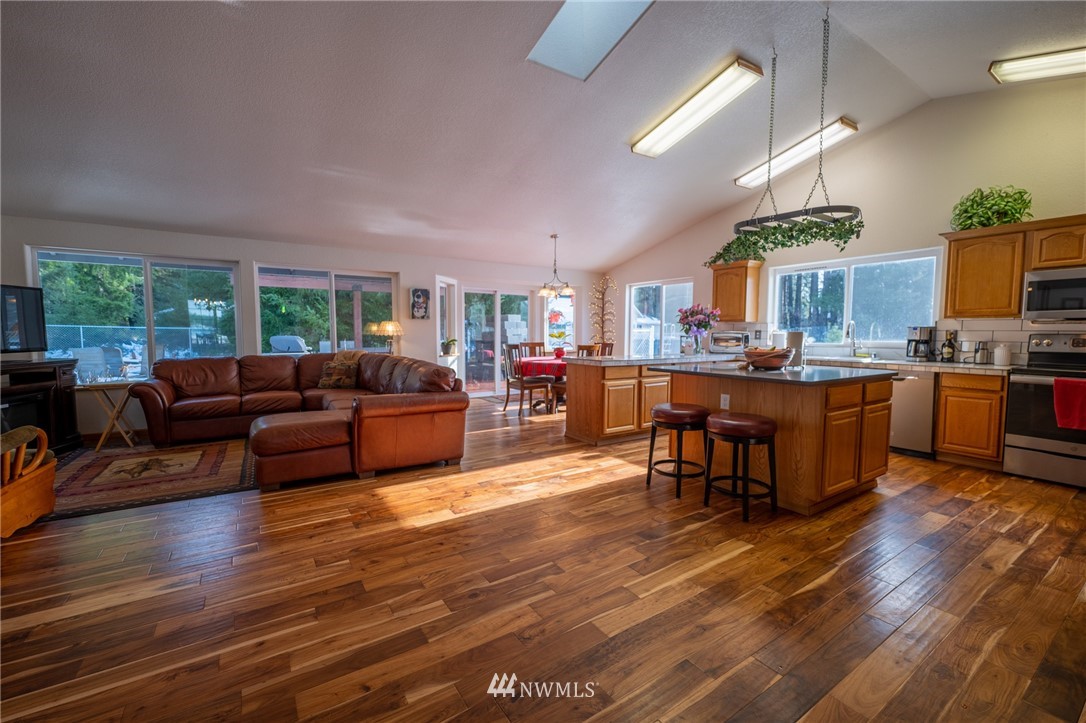 7514 191st Avenue Southwest Rochester, WA 98579 - Photo 23 of 39 a living room with furniture and a wooden floor