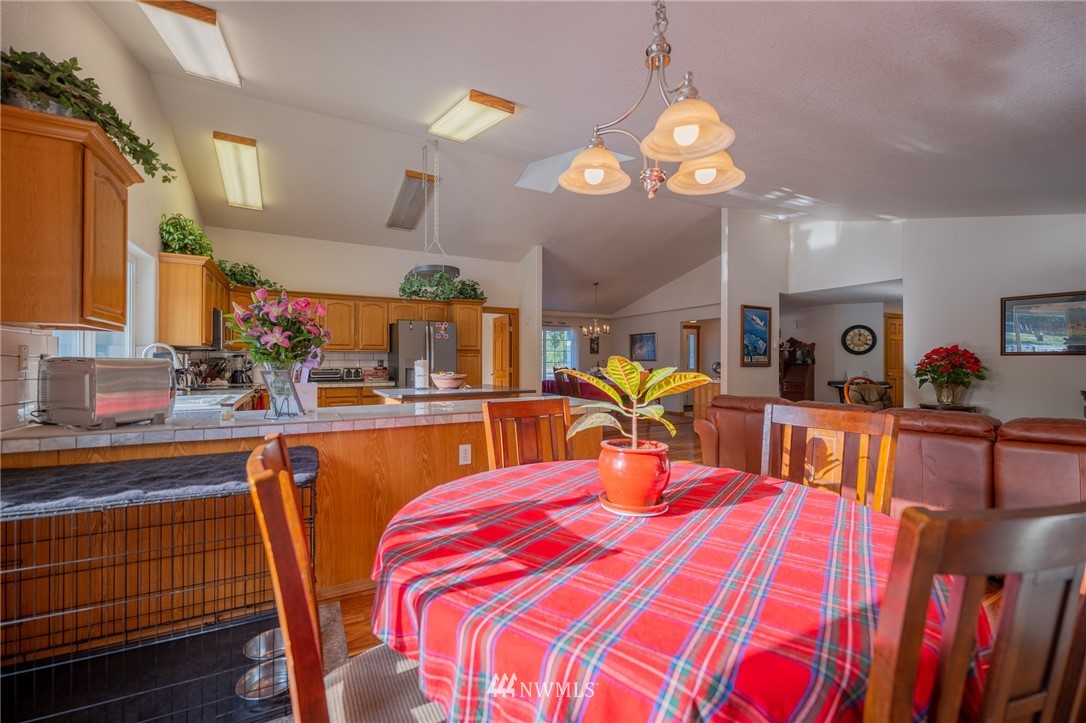 7514 191st Avenue Southwest Rochester, WA 98579 - Photo 26 of 39 a view of a dining room with furniture and chandelier