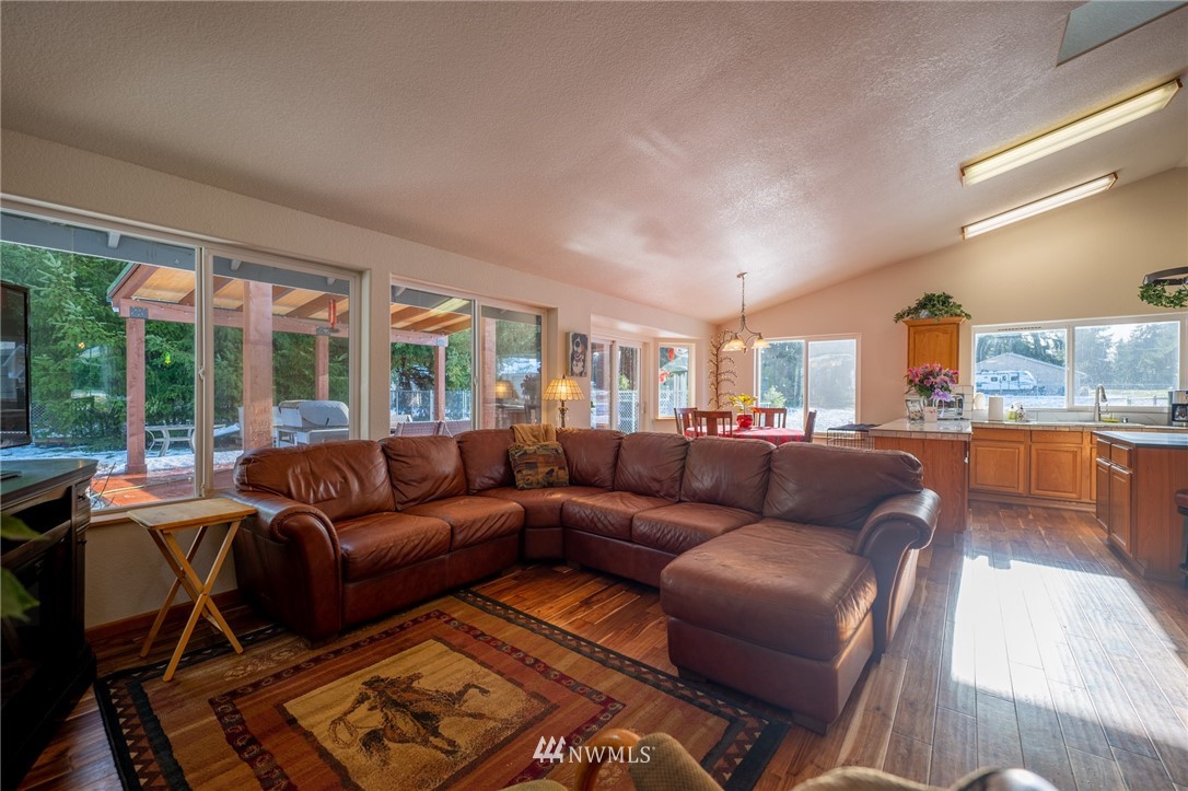 7514 191st Avenue Southwest Rochester, WA 98579 - Photo 27 of 39 a living room with furniture and a large window