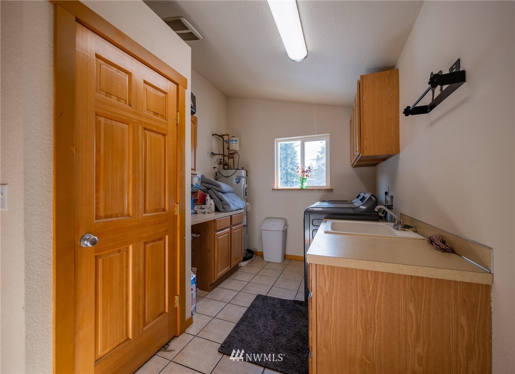 7514 191st Avenue Southwest Rochester, WA 98579 - Photo 29 of 39 a room with storage and utility