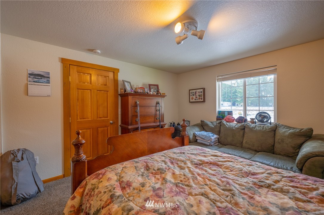 7514 191st Avenue Southwest Rochester, WA 98579 - Photo 5 of 39 a bedroom with furniture and a window