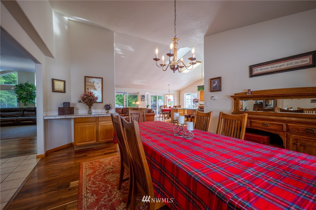 7514 191st Avenue Southwest Rochester, WA 98579 - Photo 8 of 39 a view of a dining room with furniture and chandelier