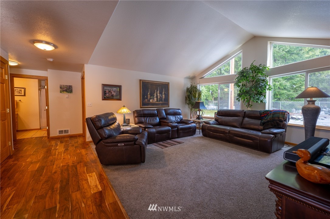 7514 191st Avenue Southwest Rochester, WA 98579 - Photo 10 of 39 a living room with furniture and a window