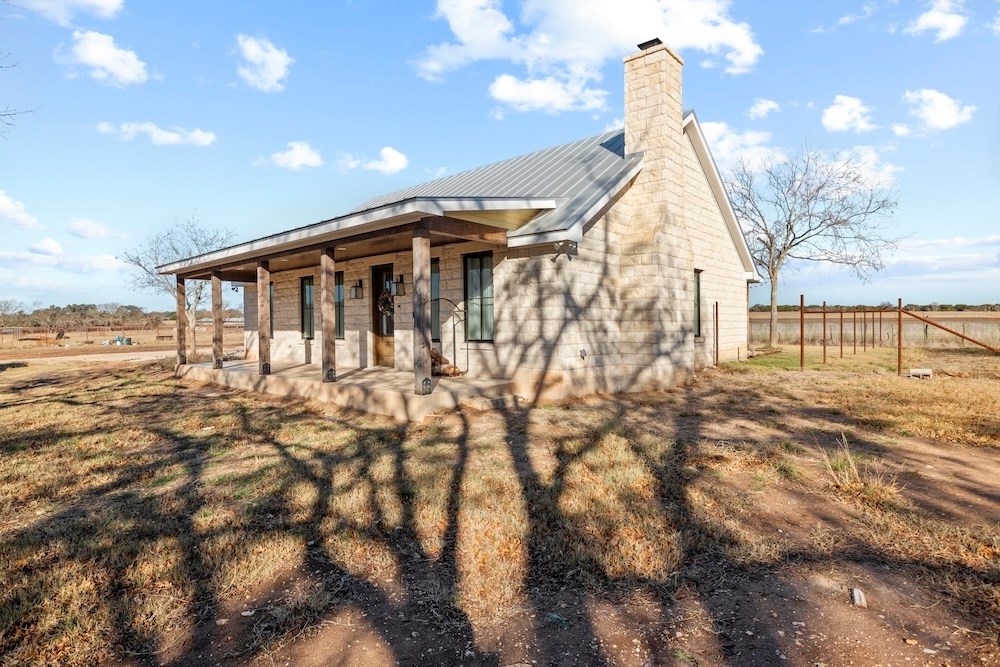 1410 Grapetown Road Fredericksburg, TX 78624 - Photo 15 of 60 a view of a house with a yard