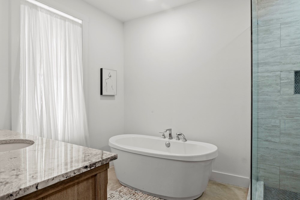 1410 Grapetown Road Fredericksburg, TX 78624 - Photo 28 of 60 a bathroom with a sink and a mirror
