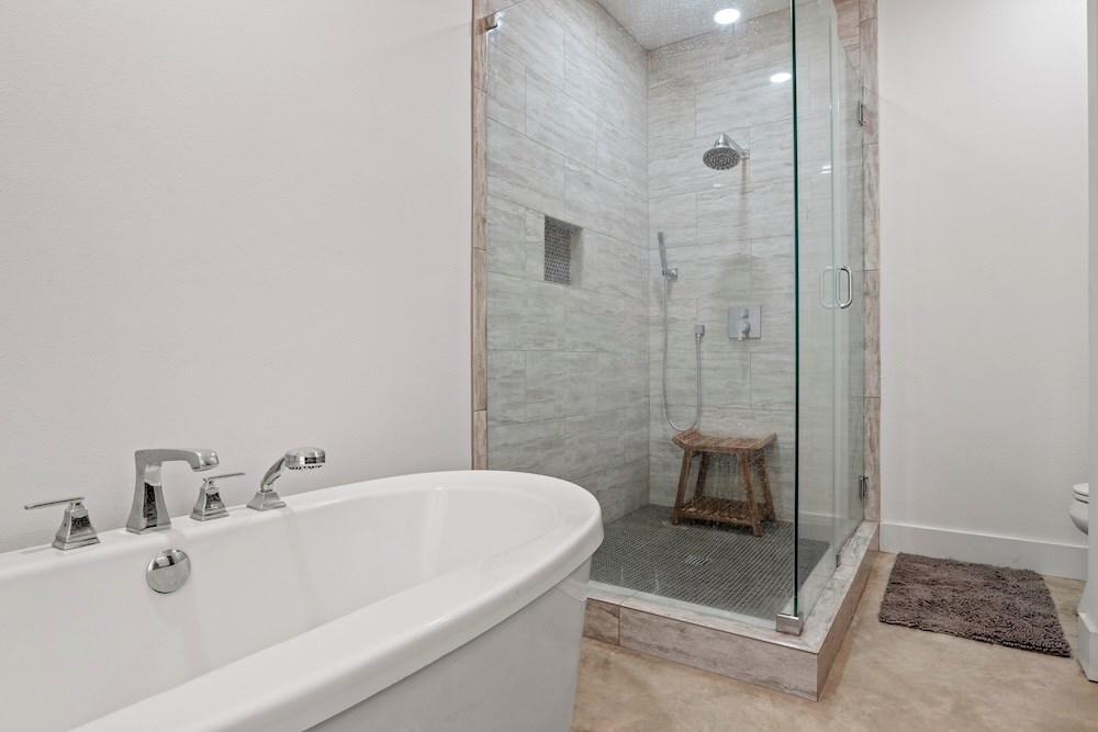 1410 Grapetown Road Fredericksburg, TX 78624 - Photo 29 of 60 a bathroom with a sink a shower and mirror