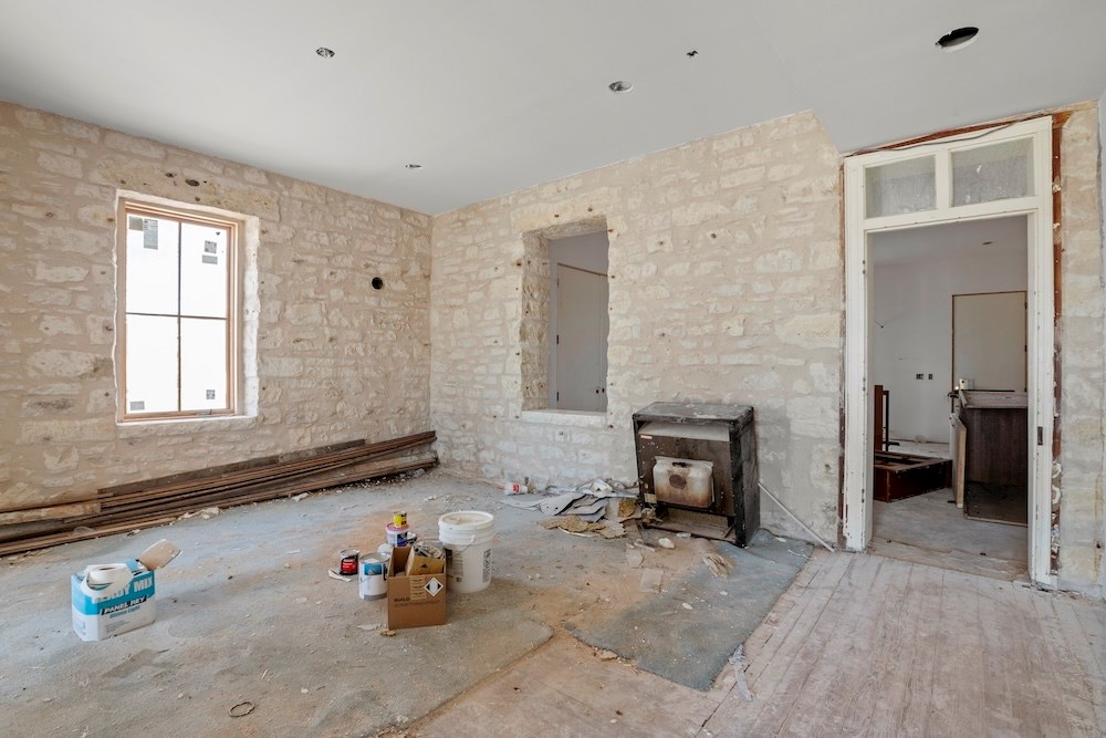 1410 Grapetown Road Fredericksburg, TX 78624 - Photo 3 of 60 a room with furniture and a fireplace