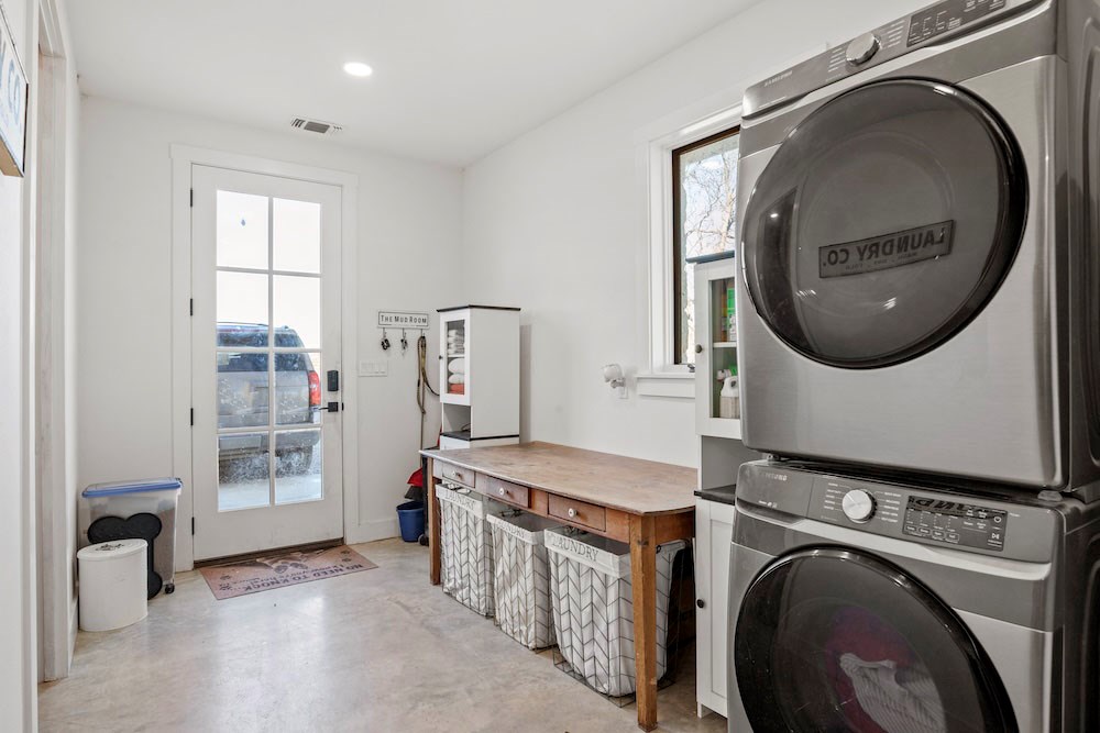 1410 Grapetown Road Fredericksburg, TX 78624 - Photo 32 of 60 a utility room with dryer and washer